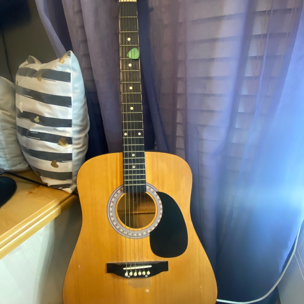 Acoustic Guitar with Green Pickguard